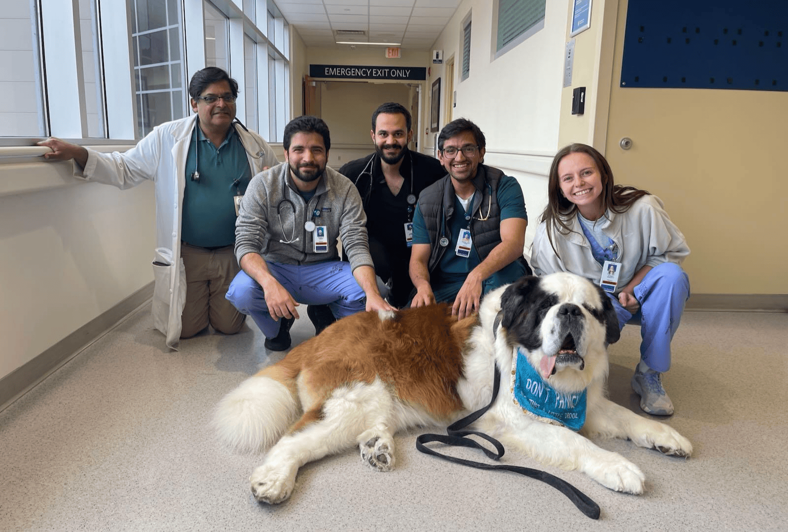 Resident group photo with therapy dog