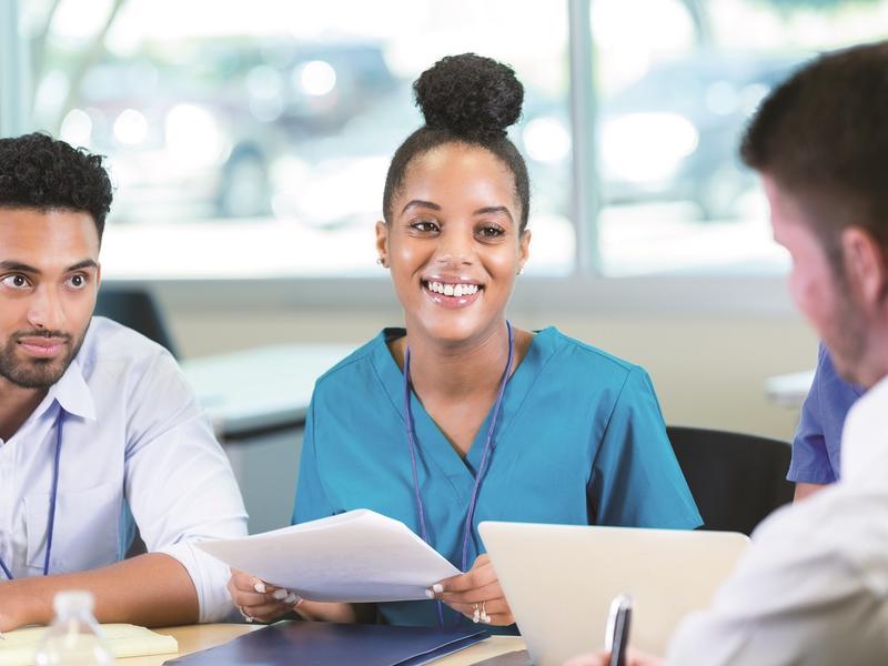 Group of medical professionals sitting at a table