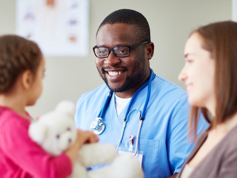 Physician with mother and child