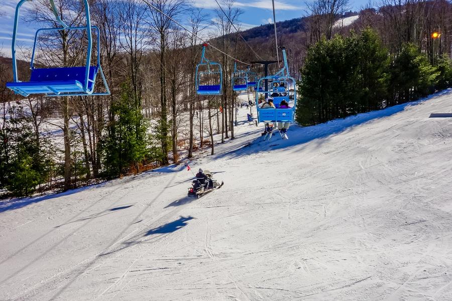 empty ski lift coming down a mountain