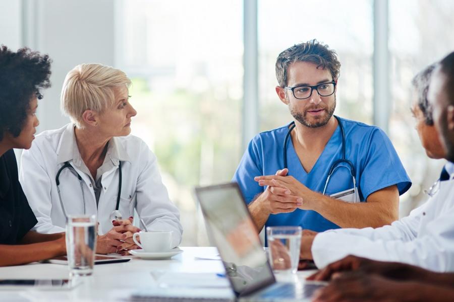 Doctors sitting around a table