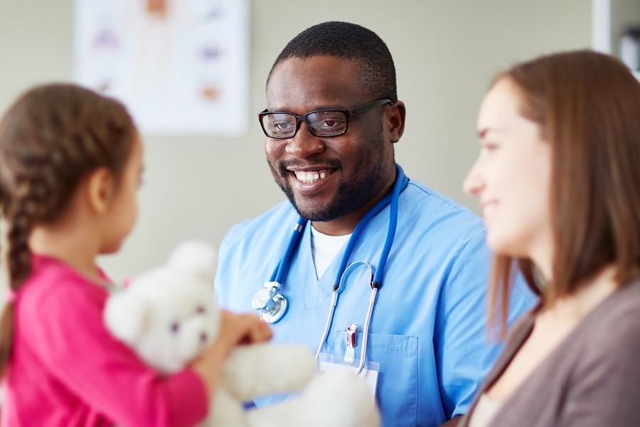 Physician with mother and child