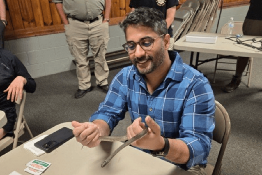 Resident holding snake during wilderness rotation