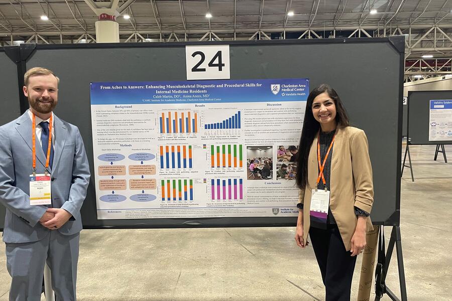 Drs. Anees and Martin with research poster