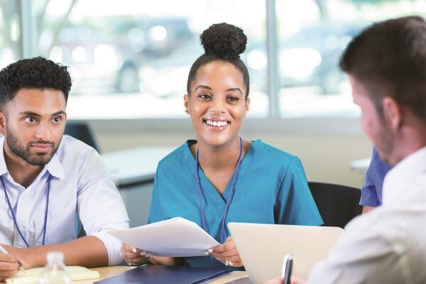 Group of medical professionals sitting at a table