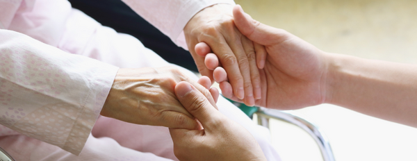 Holding patient hands