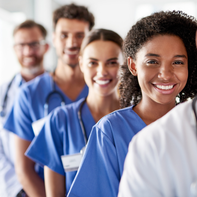 Physicians standing in line, smiling